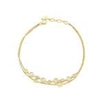 floating circle bracelet in yellow gold on white background