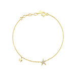 twin star bracelet in yellow gold on white background