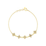 star cluster bangle in yellow gold on white background
