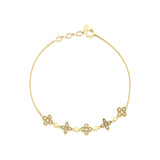star cluster bangle in yellow gold on white background