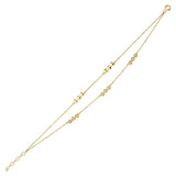 dual stud bracelet in yellow gold on white background