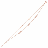 dual stud bracelet in rose gold on white background
