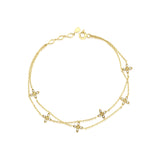 layered bloom bracelet in yellow gold on white background