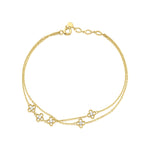 clover strand bracelet in yellow gold on white background