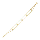 beaded starburst bracelet in yellow gold on white background