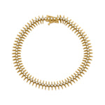 spike station bracelet in yellow gold on white background