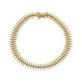 spike station bracelet in yellow gold on white background