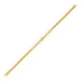 filigree medallion bracelet in yellow gold on white background
