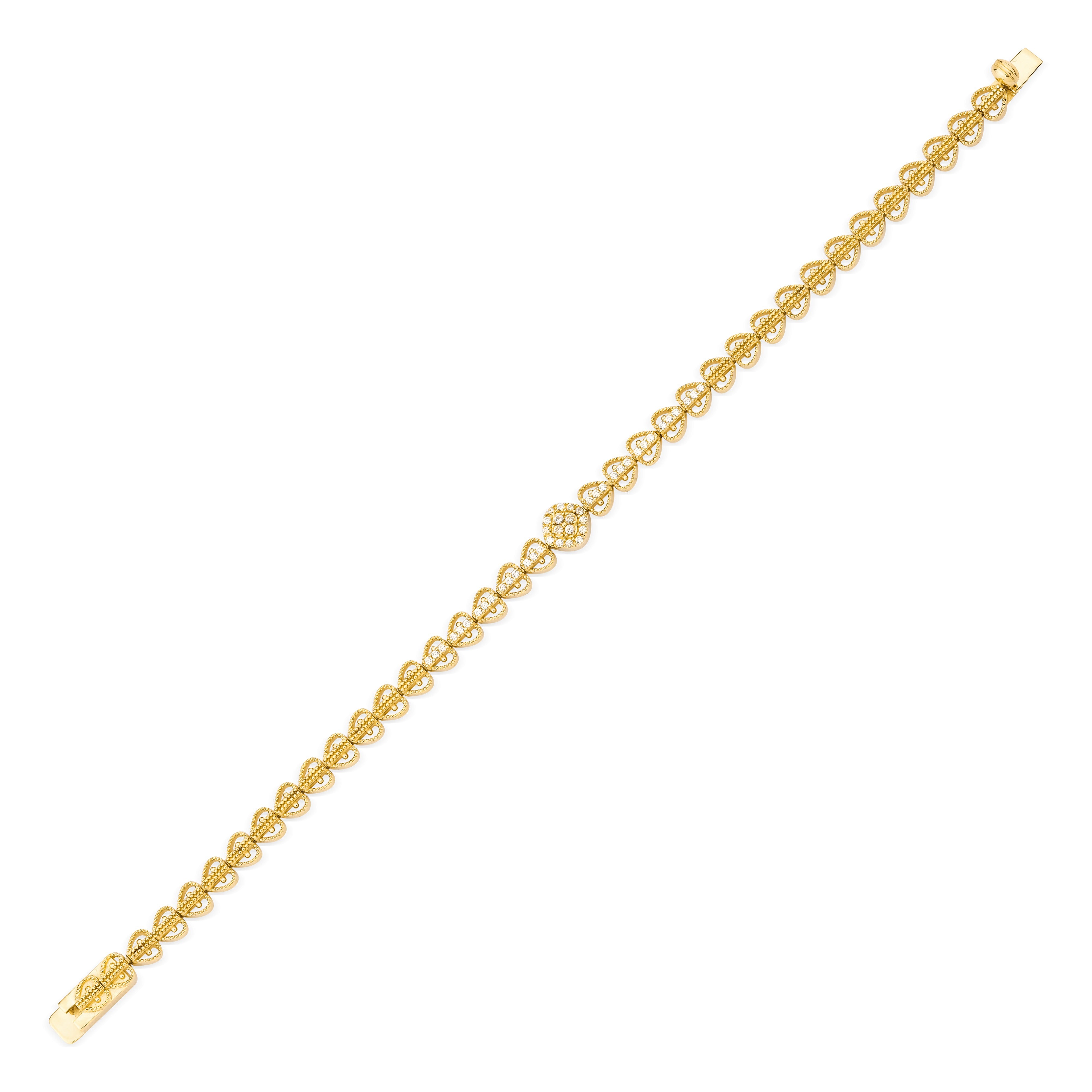 filigree medallion bracelet in yellow gold on white background