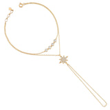 draped starburst bracelet in yellow gold on white background