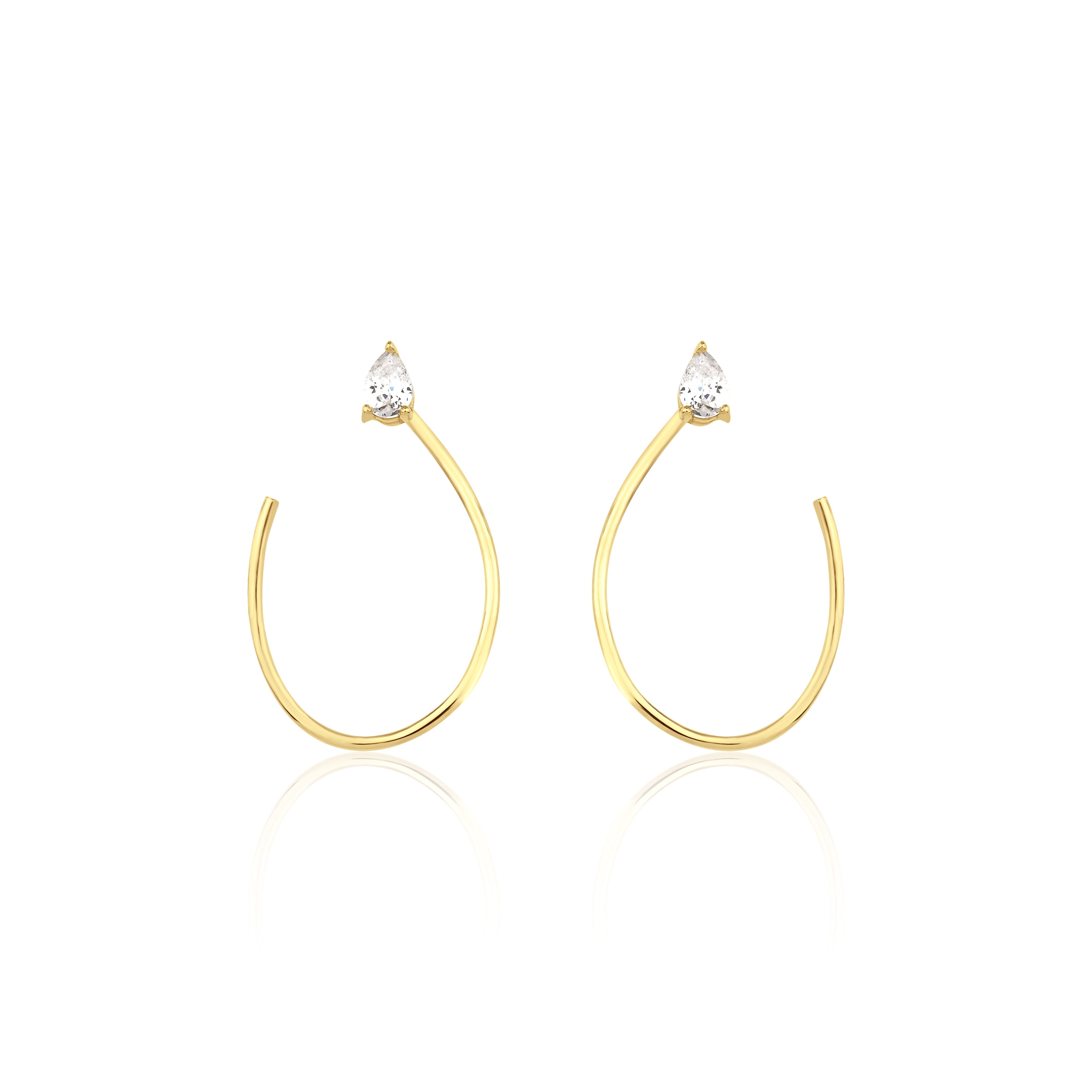 open loop earrings in yellow gold on white background
