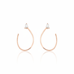 open loop earrings in rose gold on white background