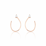 open loop earrings in rose gold on white background
