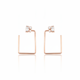 rectangle baguette earrings in rose gold on white background