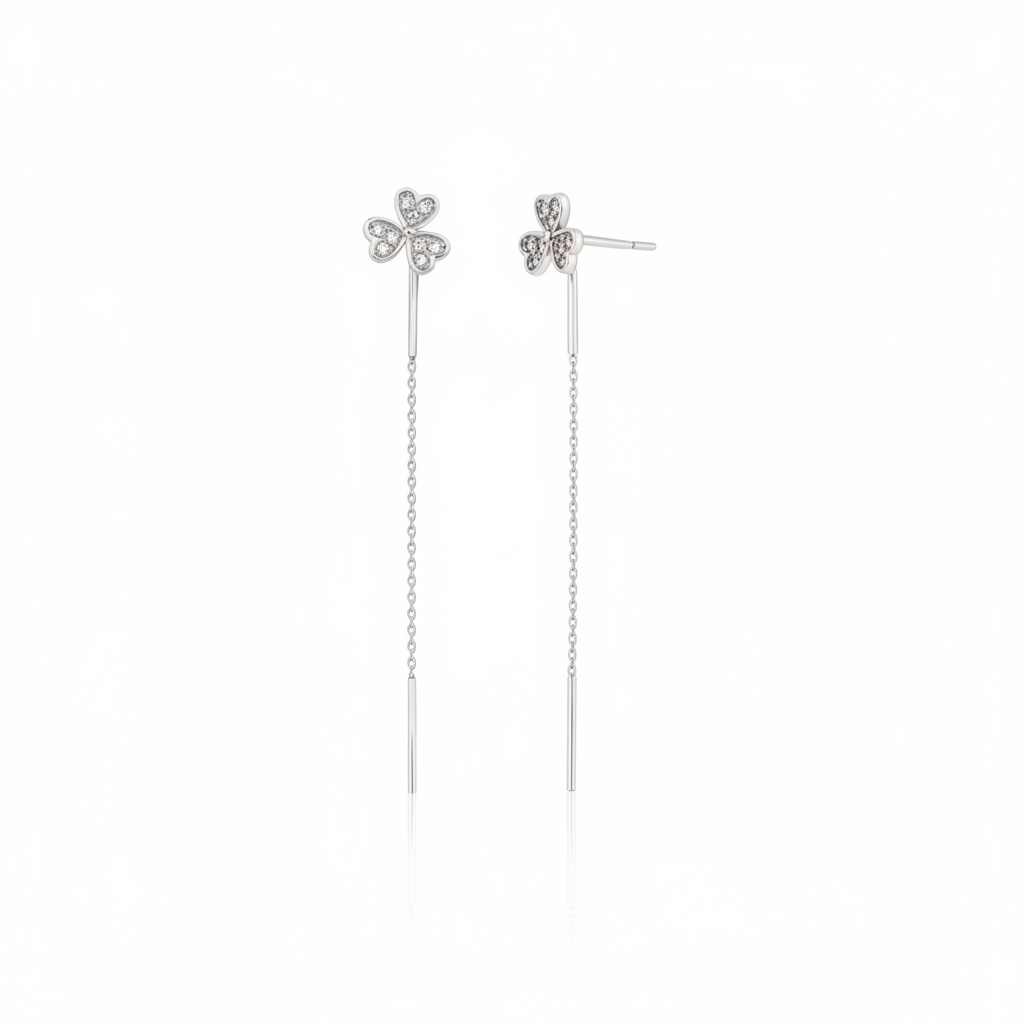 white gold clover threader earrings on white background