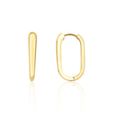 yellow gold oval hoop earrings on white background