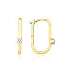 yellow gold oval spark hoop earrings on white background