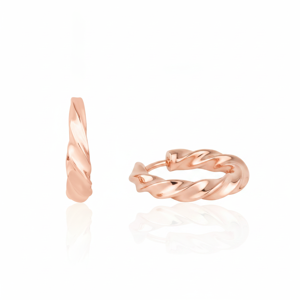 rose gold twist huggie earrings on white background