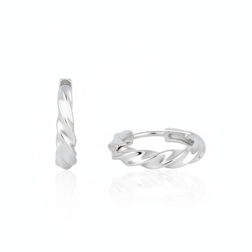 white gold twist huggie earrings on white background