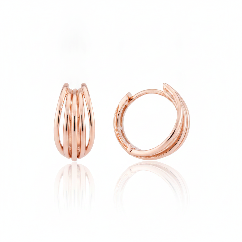 rose gold arc huggie earrings on white background
