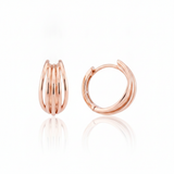 rose gold arc huggie earrings on white background