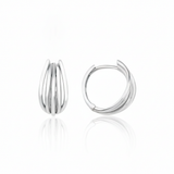 white gold arc huggie earrings on white background