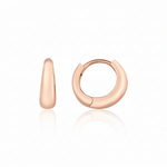 rose gold volume huggie earrings on white background