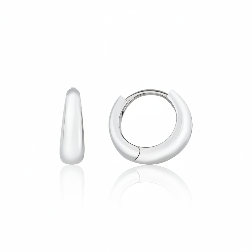 white gold volume huggie earrings on white background