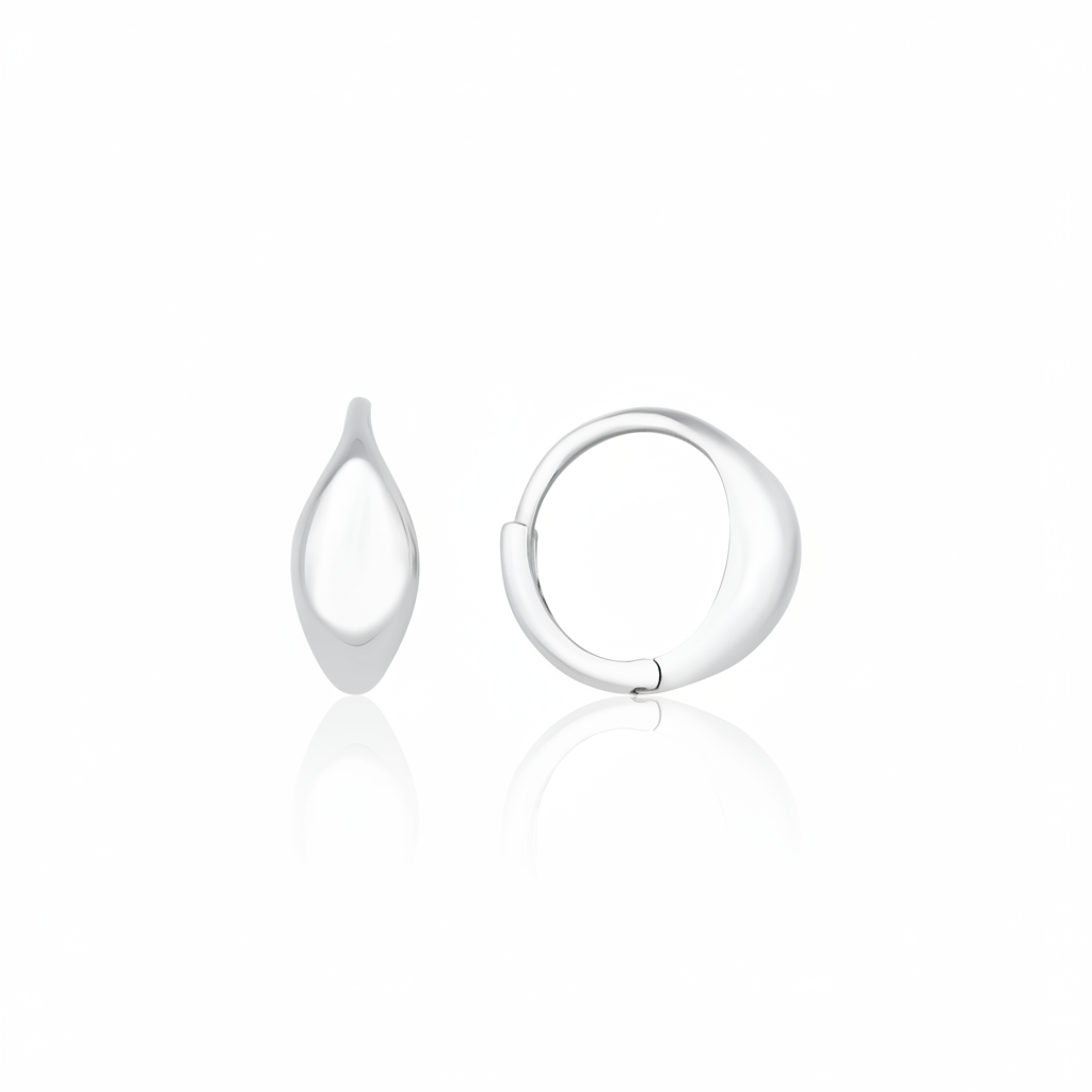white gold curve huggie earrings on white background