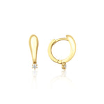 yellow gold tapered spark huggie earrings on white background