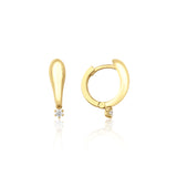 yellow gold tapered spark huggie earrings on white background