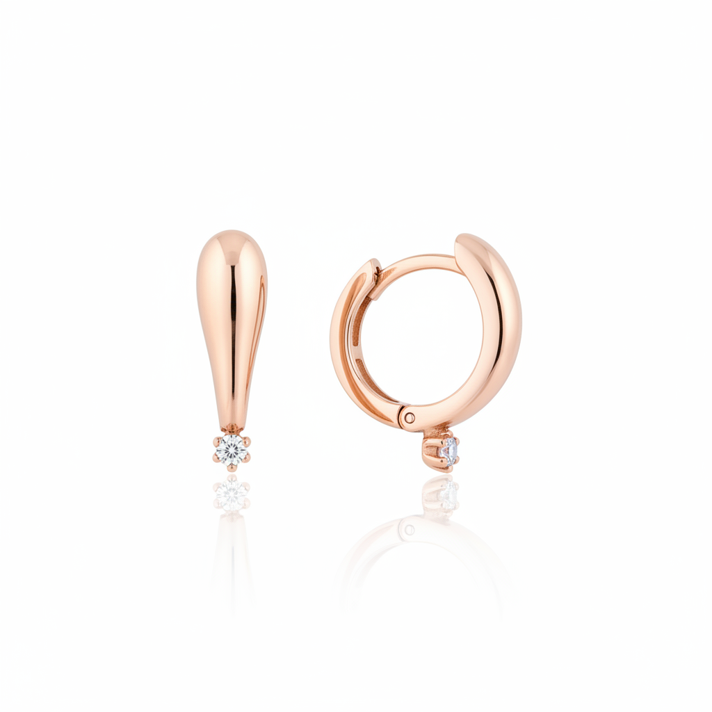 rose gold tapered spark huggie earrings on white background