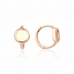 rose gold disk huggie earrings on white background