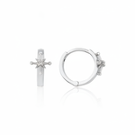 white gold starburst huggie earrings on white background