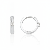 white gold solitaire huggie earrings on white background