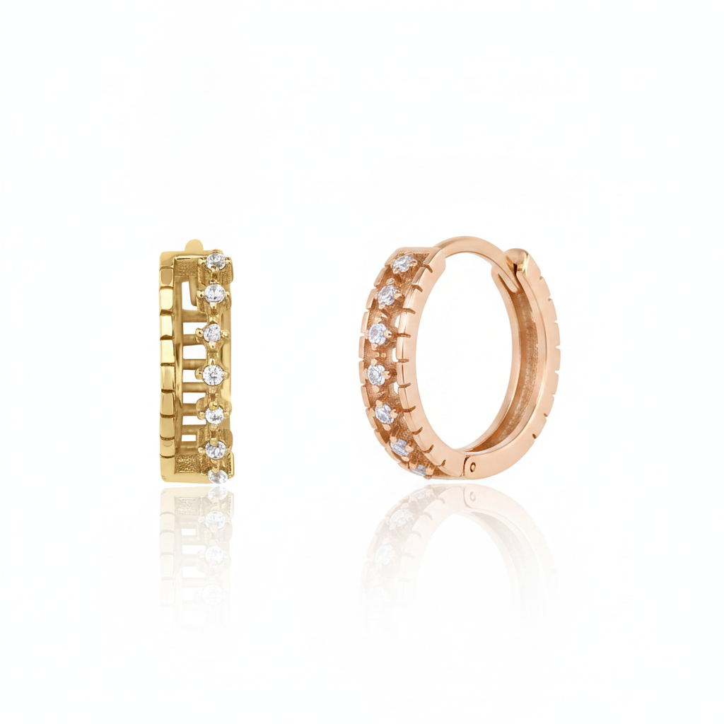 rose gold notched huggie earrings on white background