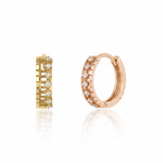 rose gold notched huggie earrings on white background