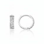 white gold notched huggie earrings on white background