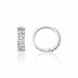 white gold notched huggie earrings on white background