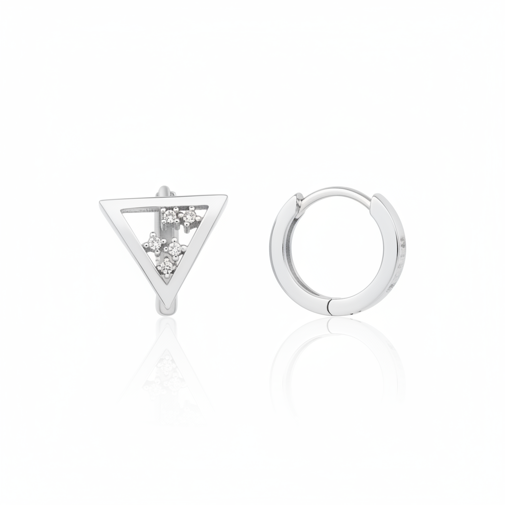 white gold triangle huggie earrings on white background