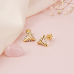 gold triangular stud earrings with pave White CZ stones along the border on a blush background with dried baby's breath