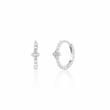 white gold quatrefoil huggie earrings on white background