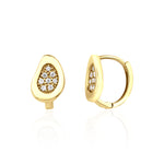 yellow gold teardrop huggie earrings on white background