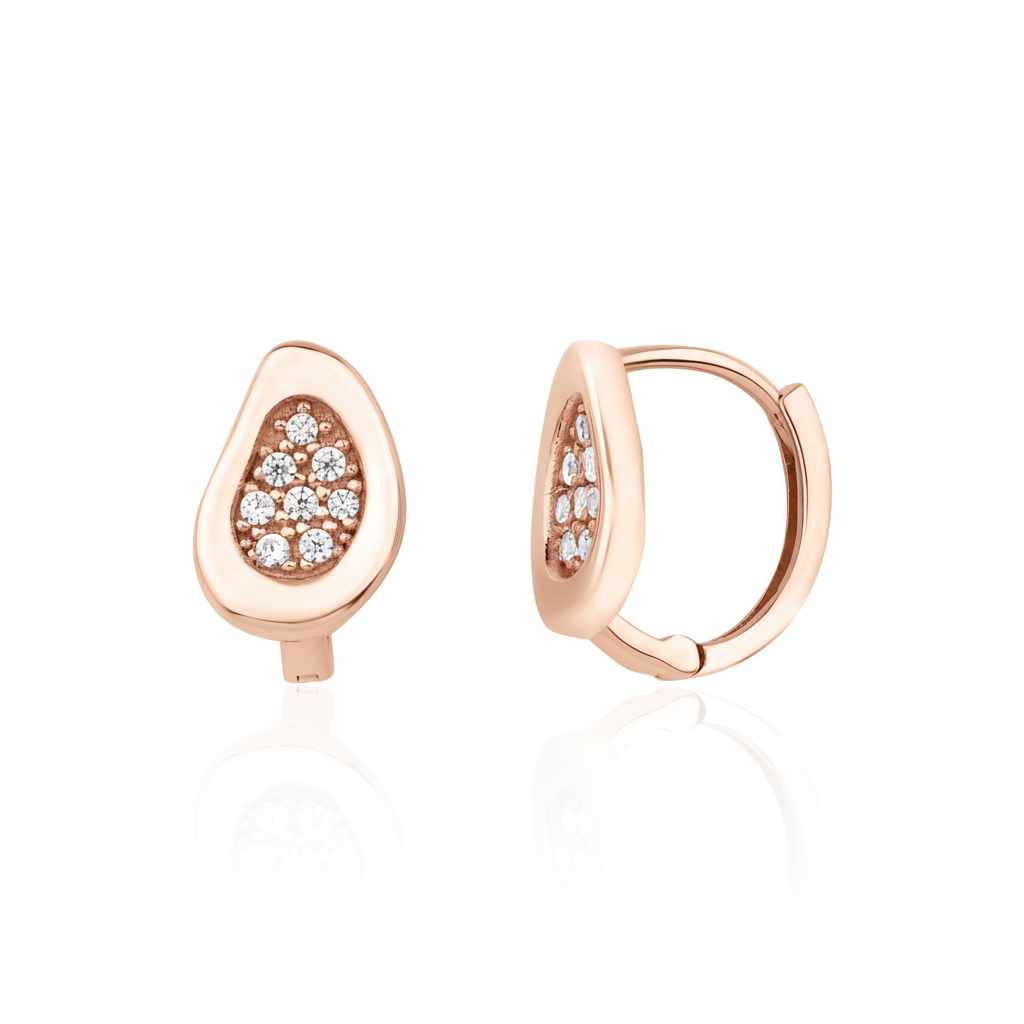 rose gold teardrop huggie earrings on white background