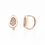 rose gold teardrop huggie earrings on white background