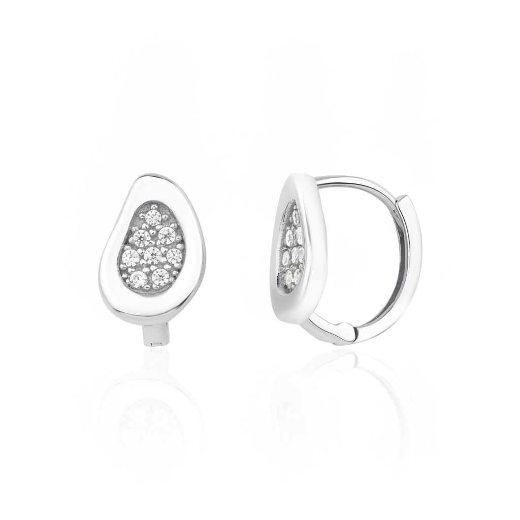 white gold teardrop huggie earrings on white background