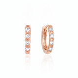 rose gold quad spark huggie earrings on white background