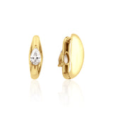 yellow gold pear spark huggie earrings on white background