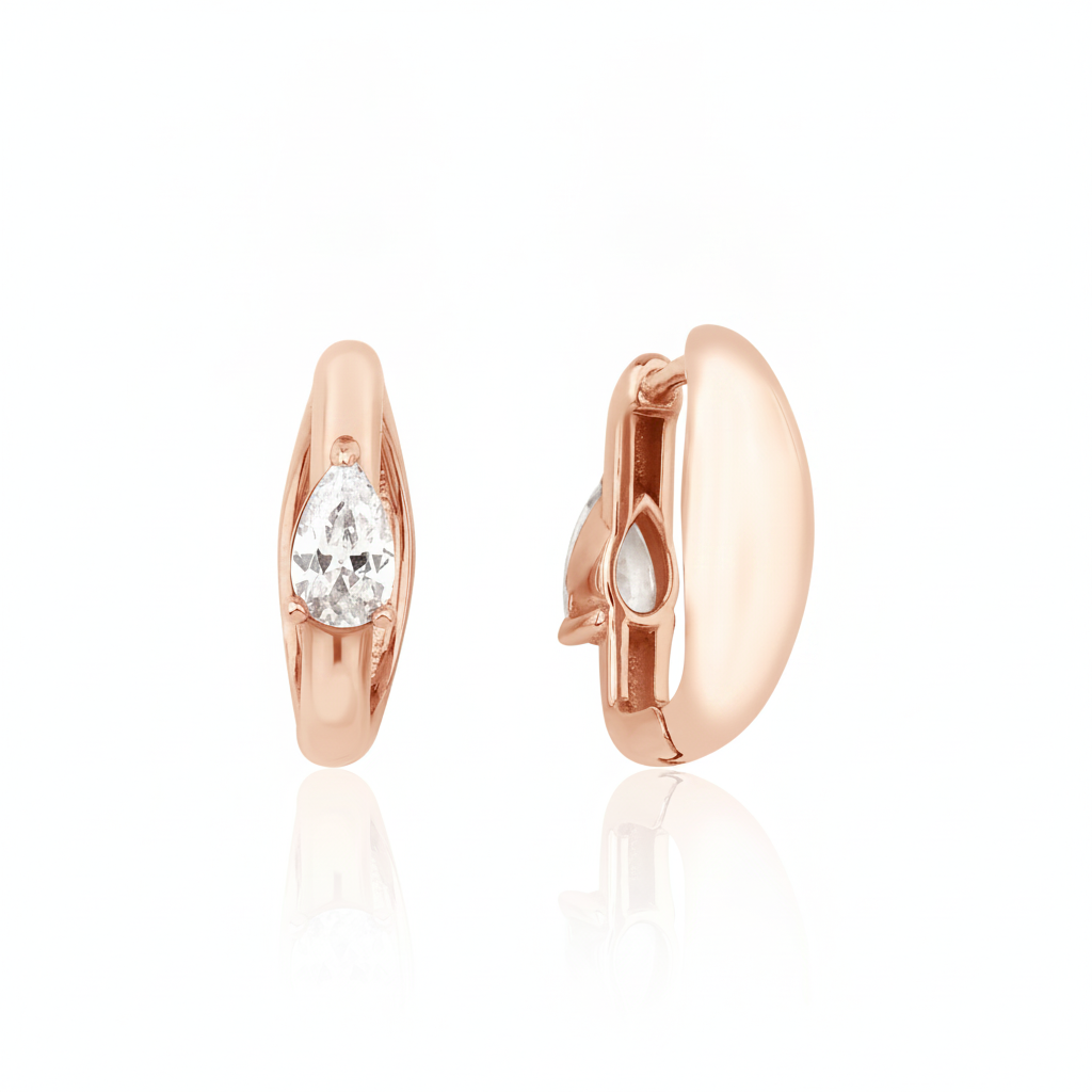 rose gold pear spark huggie earrings on white background