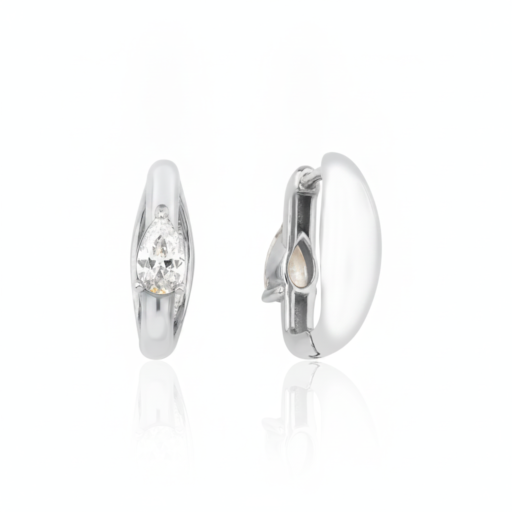 white gold pear spark huggie earrings on white background